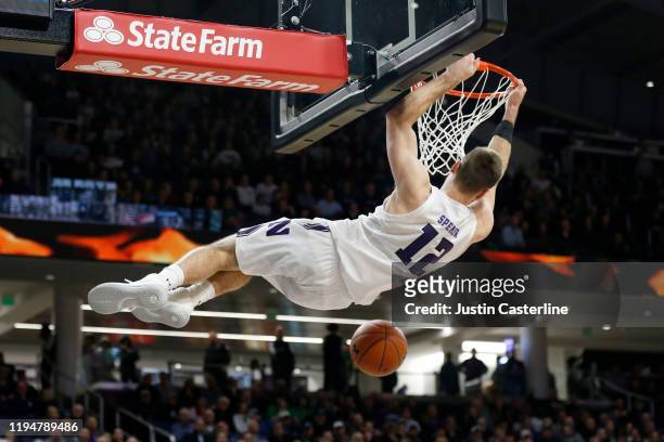 Pat Spencer of the Northwestern Wildcats dunks the ball in the game against the Michigan State Spartans during the second half at Welsh-Ryan Arena on...