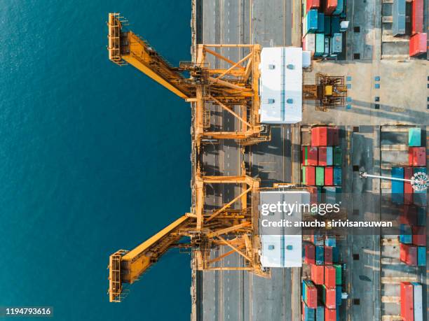 aerial top view crane car lifting container in warehouse. - shipping container top view - fotografias e filmes do acervo