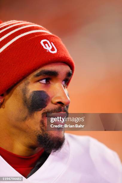 Quarterback Jalen Hurts of the Oklahoma Sooners wraps up an interview after defeating the Oklahoma State Cowboys in their Bedlam game on November 30,...