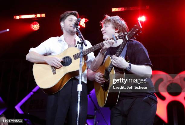 Niall Horan and Lewis Capaldi perform during 103.5 KISS FM's Jingle Ball 2019 - Show on December 18, 2019 in Chicago, Illinois.