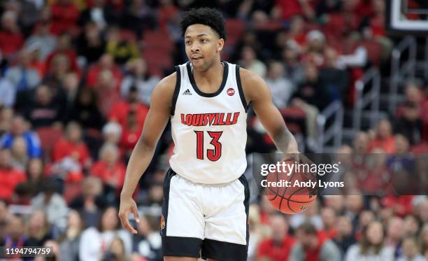 David Johnson of the Louisville Cardinals dribbles the ball against the Miami-Ohio Redhawks at KFC YUM! Center on December 18, 2019 in Louisville,...