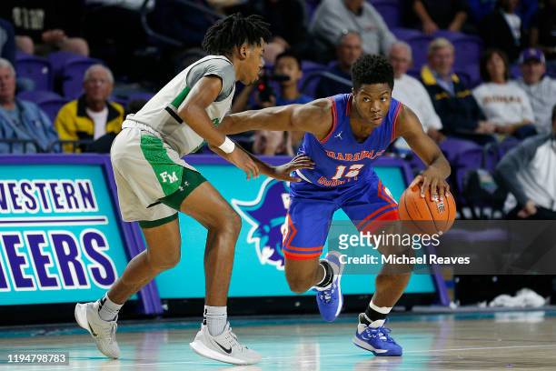 Zion Harmon of Marshall County High School dribbles with the ball against Fort Myers High School during the City of Palms Classic Day 1 at Suncoast...