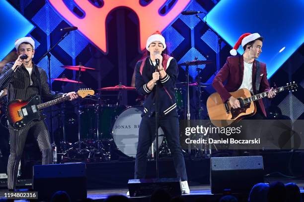 Nick Jonas, Joe Jonas, Kevin Jonas of the Jonas Brothers perform during 103.5 KISS FM's Jingle Ball 2019 - Show on December 18, 2019 in Chicago,...