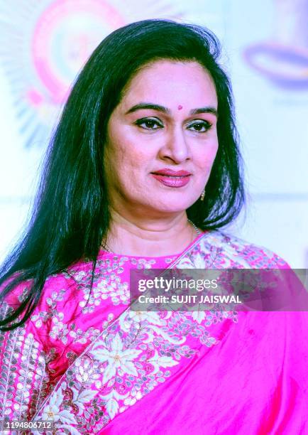 In this picture taken on January 19 Bollywood actress and singer Padmini Kolhapure poses for photographs as she arrives to attend the annual 'Umang...