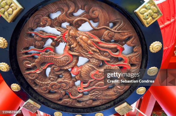 cut out of asakusa temple intricate insignia, tokyo, japan. - shinto stock pictures, royalty-free photos & images