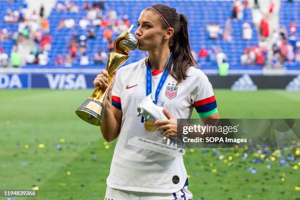 Alex Morgan of the USA women's national team celebrating with trophy and the second best scorer in the tournament award after the 2019 FIFA Women's...