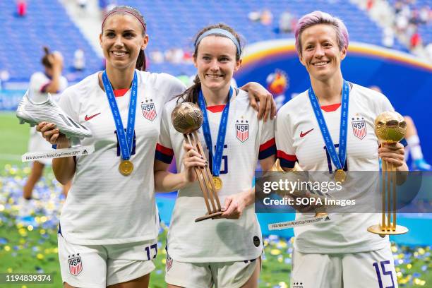 Alex Morgan celebrating the second scorer in the tournament award, Rose Lavelle celebrating the third player in the tournament award and Megan...