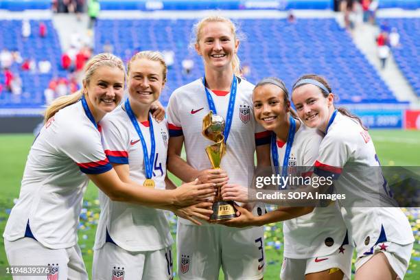 Lindsey Horan , Emily Sonnett , Sam Mewis , Mallory Pugh and Rose Lavelle celebrating with trophy after the 2019 FIFA Women's World Cup Final match...