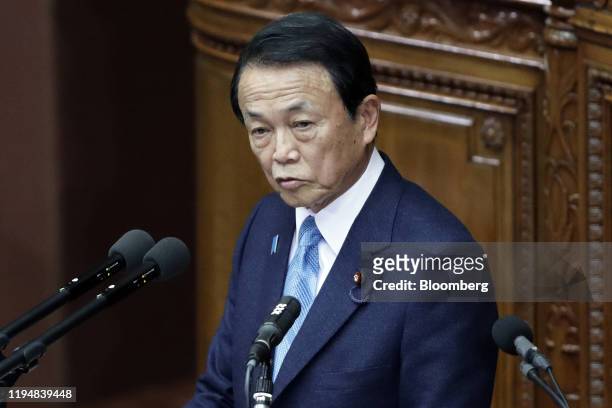Taro Aso, Japan's deputy prime minister and finance minister, delivers a speech during an ordinary session at the lower house of the parliament in...