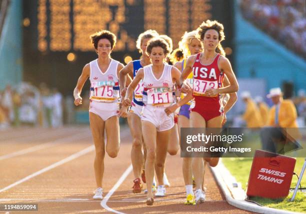 Mary Decker of the United States, Zola Budd of Great Britain running bare footed and Wendy Sly of Great Britain compete in the final of the Women's...