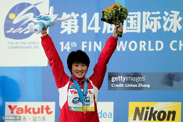 Chen Ruolin of the People's Republic of China celebrates winning the gold medal in the Women's 10m Platform Final during Day Six of the 14th FINA...