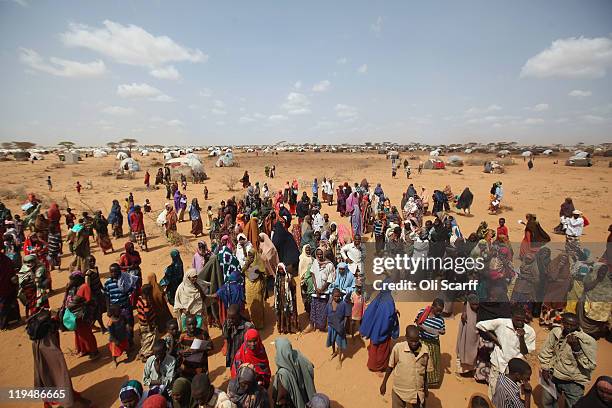 Newly arrived Somalian refugees queue for tents being distributed by the Lutheran World Federation charity on the edge of the Dagahaley refugee camp...