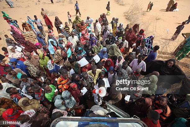 Newly arrived Somalian refugees queue for tents being distributed by the Lutheran World Federation charity on the edge of the Dagahaley refugee camp...