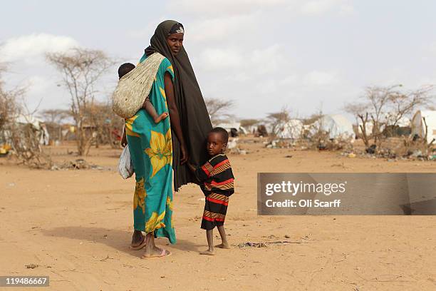 Newly arrived Somalian refugees settle on the edge of the Dagahaley refugee camp which makes up part of the giant Dadaab refugee settlement on July...