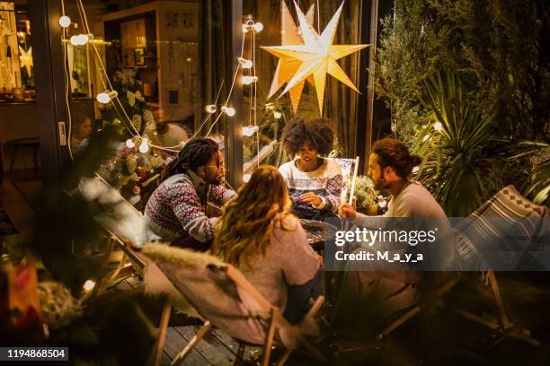 friends roasting marshmallows at back yard - backyard vacations stock pictures, royalty-free photos & images