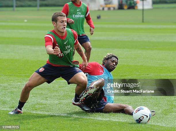 Jack Wilshere and Alex Song of Arsenal during a training session at London Colney on July 21, 2011 in St Albans, England.