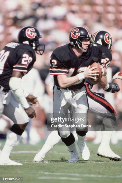 Jim Kelly#12, Quarterback for the Houston Gamblers runs the ball during the USFL United States Football League Western Conference game against the...