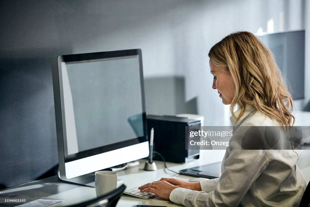 Female Using Computer In Office High-Res Stock Photo - Getty Images