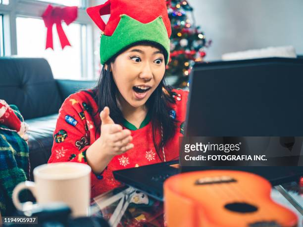 millennial christmas party - ugly asian woman stock pictures, royalty-free photos & images
