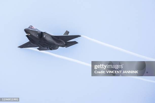 An F-35 military aircraft of the Royal Netherlands Air Force trains on targets at the NATO training location at the Vliehors Range on Vlieland. /...