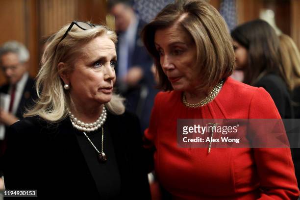 Speaker of the House Rep. Nancy Pelosi talks to Rep. Debbie Dingell after an event at the Rayburn Room of the U.S. Capitol December 19, 2019 in...