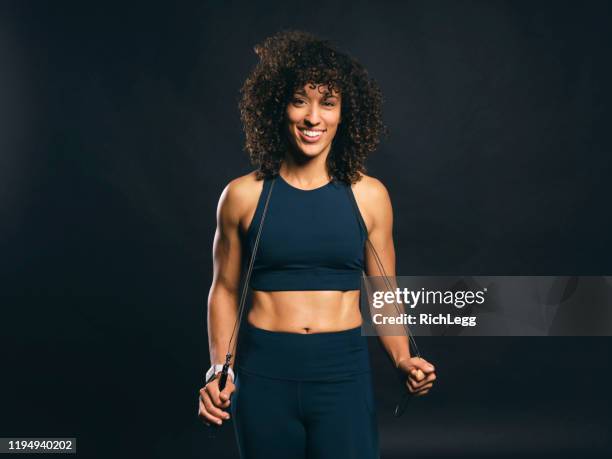 fit woman with jump rope - personal trainer stock pictures, royalty-free photos & images