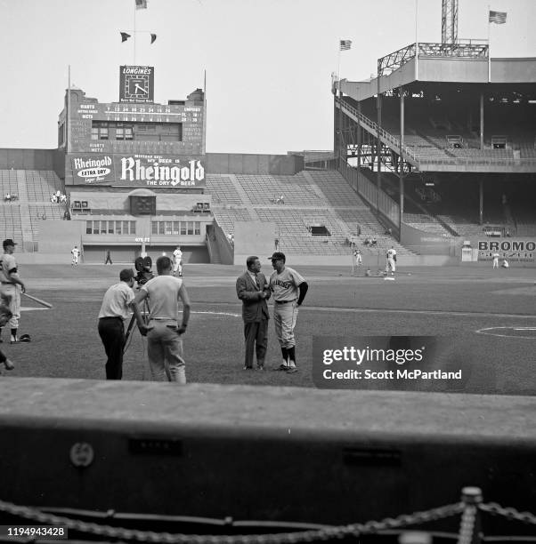 An sports reporter interviews an unidentified member of the San Francisco Giants baseball team at the Polo Grounds prior to a game against the New...