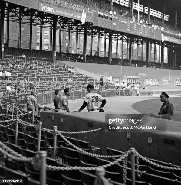 American baseball player Gaylord Perry , of the San Francisco Giants, chats with a fan at the Polo Grounds prior to a game against the New York Mets,...