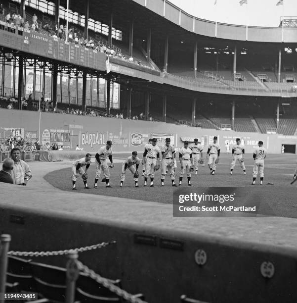 Members of the San Francisco Giants baseball team warm up at the Polo Grounds prior to a game against the New York Mets, New York, New York, June 2,...