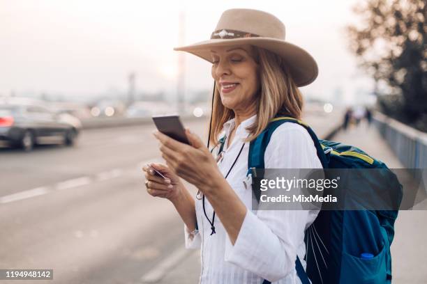 traveler carrying backpack - buyer journey stock pictures, royalty-free photos & images