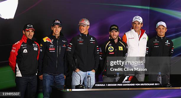 German F1 drivers Timo Glock of Marussia Virgin Racing, Sebastian Vettel of Red Bull Racing, Michael Schumacher of Mercedes GP, Nick Heidfeld of...