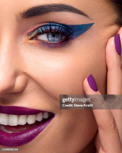 beautiful young woman with full make up touching face - eye make up stock pictures, royalty-free photos & images