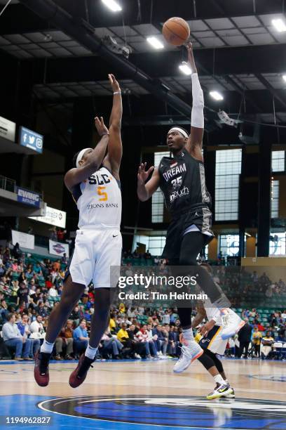 Aric Holman of the Texas Legends shoots over Jarrell Brantley of the Salt Lake City Stars during the third quarter on January 20, 2020 at Comerica...