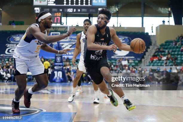 Josh Reaves of the Texas Legends drives on Jarrell Brantley of the Salt Lake City Stars during the third quarter on January 20, 2020 at Comerica...