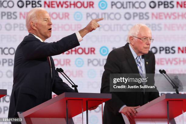 Former Vice President Joe Biden makes a point as Sen. Bernie Sanders listens during the Democratic presidential primary debate at Loyola Marymount...