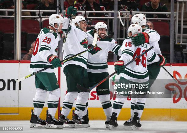 Ryan Suter, Zach Parise, Mats Zuccarello, Jared Spurgeon and Eric Staal of the Minnesota Wild celebrate after Zuccarello scored a goal against the...