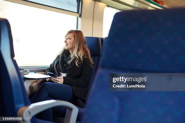 checking my train schedule online - passenger train stock pictures, royalty-free photos & images