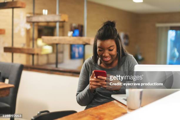 african american generation z female getting news on college funding at home - draft media opportunity stock-fotos und bilder