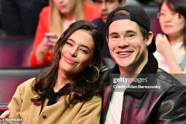Chloe Bridges and Adam DeVine attend a basketball game between the Los Angeles Clippers and the Houston Rockets at Staples Center on December 19,...
