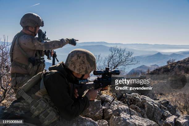 sniper team looking at the target - ammunition stock pictures, royalty-free photos & images