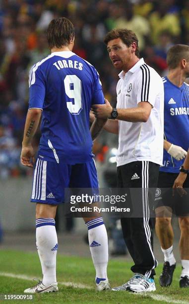 Fernando Torres of Chelsea is spoken to by Andre Villas-Boas, Manager of Chelsea, during the pre-season friendly match between Malaysia and Chelsea...