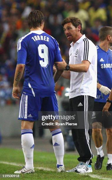 Fernando Torres of Chelsea is spoken to by Andre Villas-Boas, Manager of Chelsea, during the pre-season friendly match between Malaysia and Chelsea...