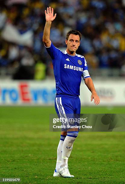 John Terry of Chelsea applauses the fans after Chelsea defeated Malaysia 1-0 during the pre-season friendly match between Malaysia and Chelsea at...