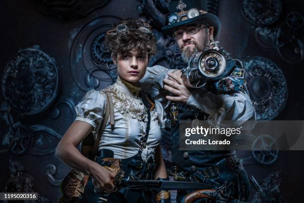 steampunk paar in een studio schot - steampunk stockfoto's en -beelden
