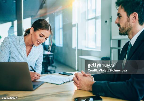 business people signing a contract. - candidate interview stock pictures, royalty-free photos & images