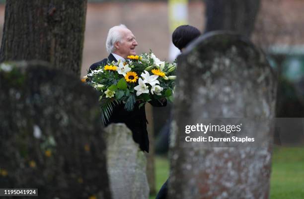 Floral tributes are carried into the church before a memorial service to celebrate the life of Saskia Jones at Holy Trinity Church on December 20,...