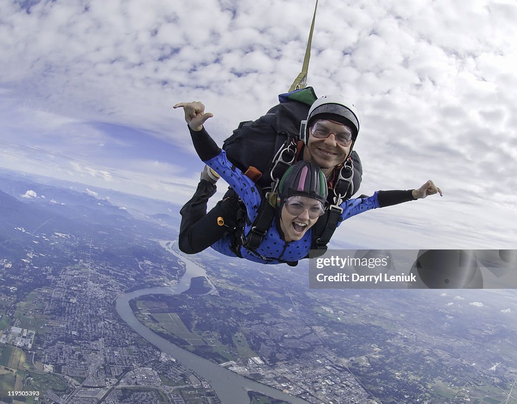 Couple tandem skydiving