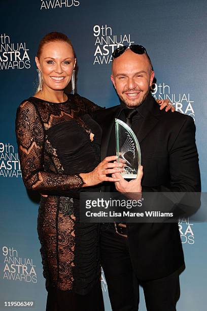 Alex Perry and Charlotte Dawson pose after Australia's Next Top Model won Most Outstanding Reality Program at the 9th Annual Astra Awards on July 21,...