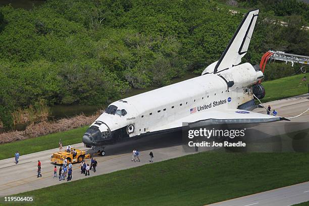 Space Shuttle Atlantis is towed at Kennedy Space Center July 21, 2011 in Cape Canaveral, Florida. Atlantis was the final shuttle mission for NASA,...