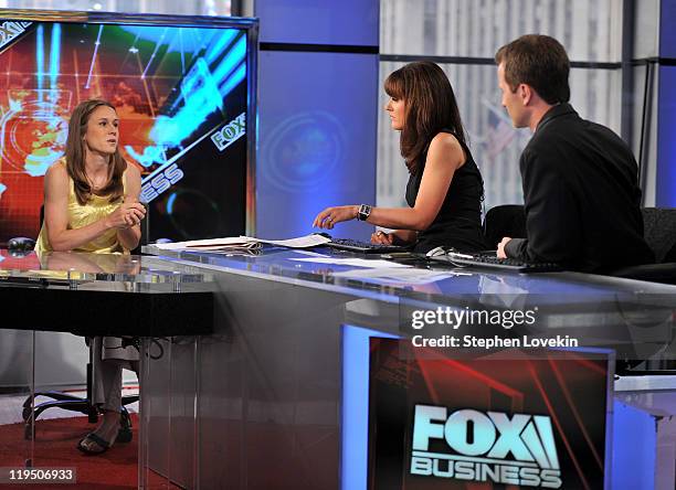 Women's soccer player Heather O'Reilly talks with hosts Dagen McDowell and Connell McShane on the set of FOX Business at FOX Studios on July 21, 2011...